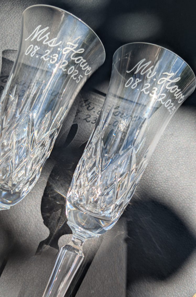 Hand engraved champagne flutes for bride and groom Mr. and Mrs. Howe, wedding keepsake at The Belvedere in Baltimore, Maryland.