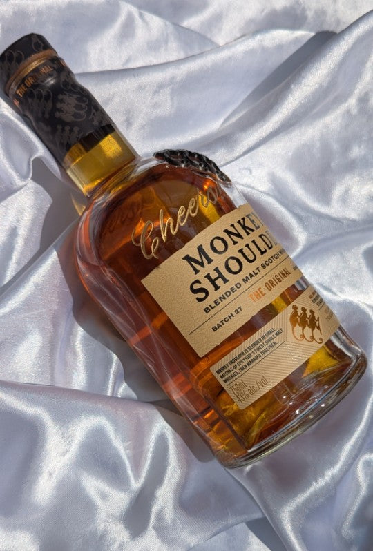 Hand engraved Monkey Shoulder whisky bottle with gold fill lettering that reads “Cheers!” Ideal for corporate gifting, luxury brand activations, and upscale event favors.
