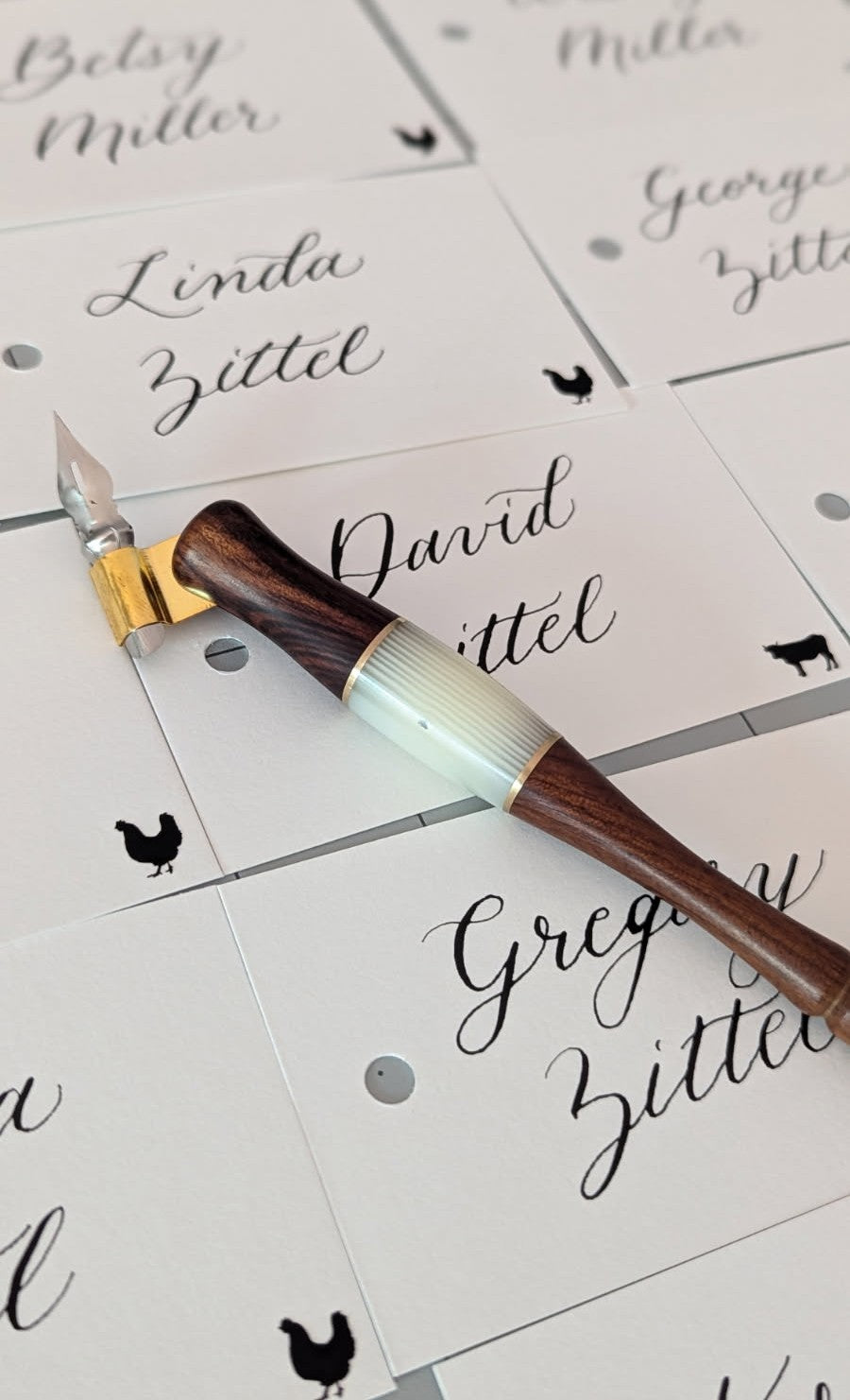 Custom wedding place cards with modern calligraphy and meal icons, Free Library of Philadelphia wedding, handcrafted with dip pen.