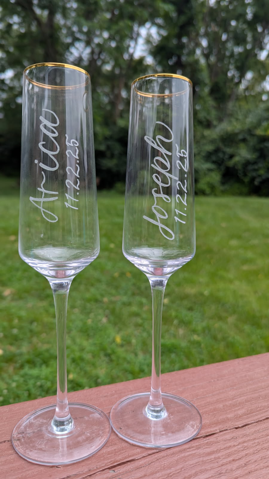 Bride and groom hand-engraved champagne flutes from an in-studio commission for a wedding in Harrisburg, PA.
