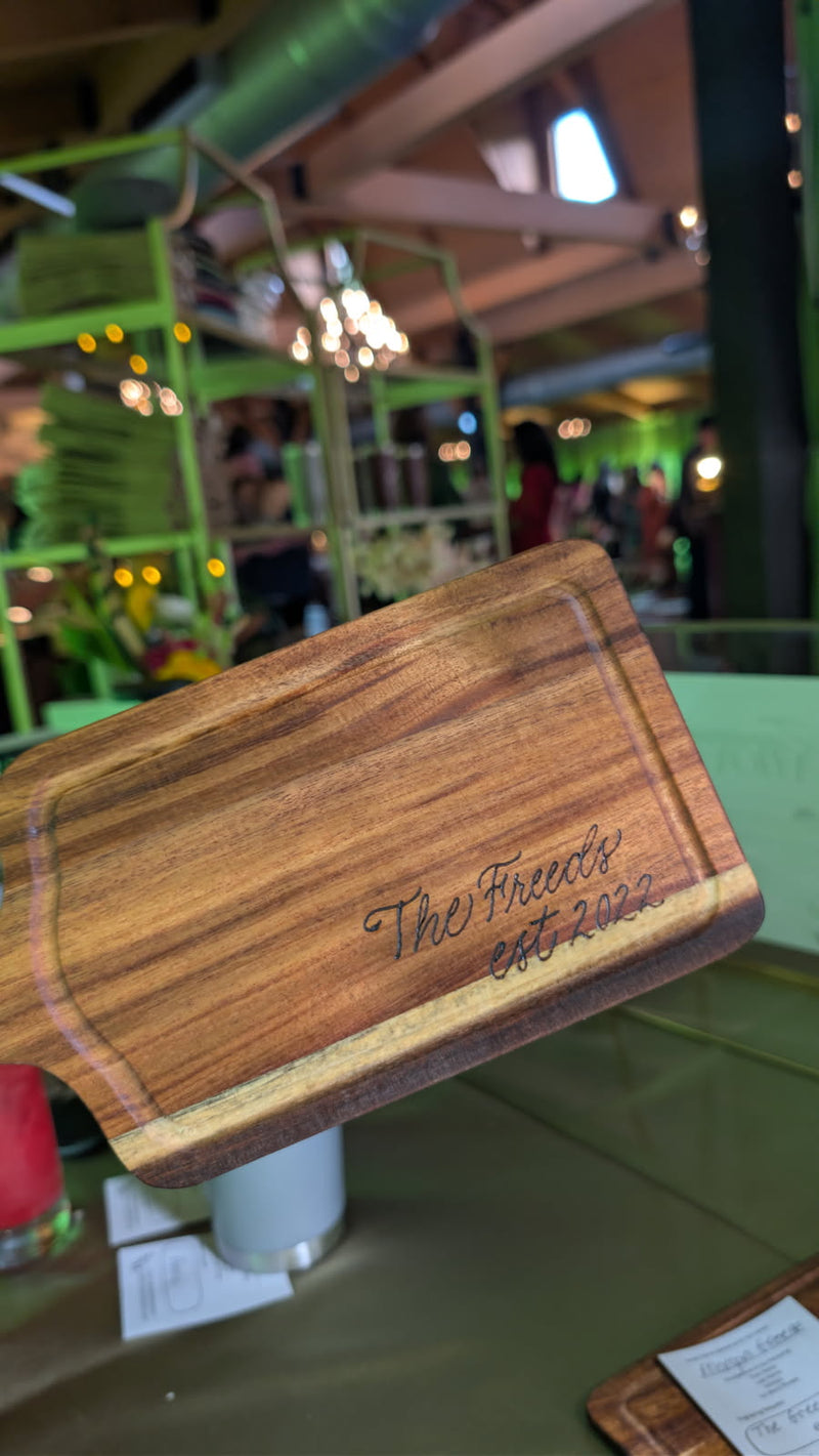 Hand wood-burned charcuterie board reading “The Freeds Est. 2022,” created for a 50th birthday celebration for the CEO of C and J Catering at Historic Acres of Hershey wedding and event venue in Hershey, Pennsylvania.
