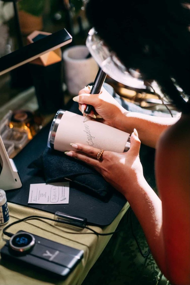 Live engraving of a stainless steel tumbler for Jamie's 50th birthday celebration at Historic Acres of Hershey venue in Hershey, PA.
