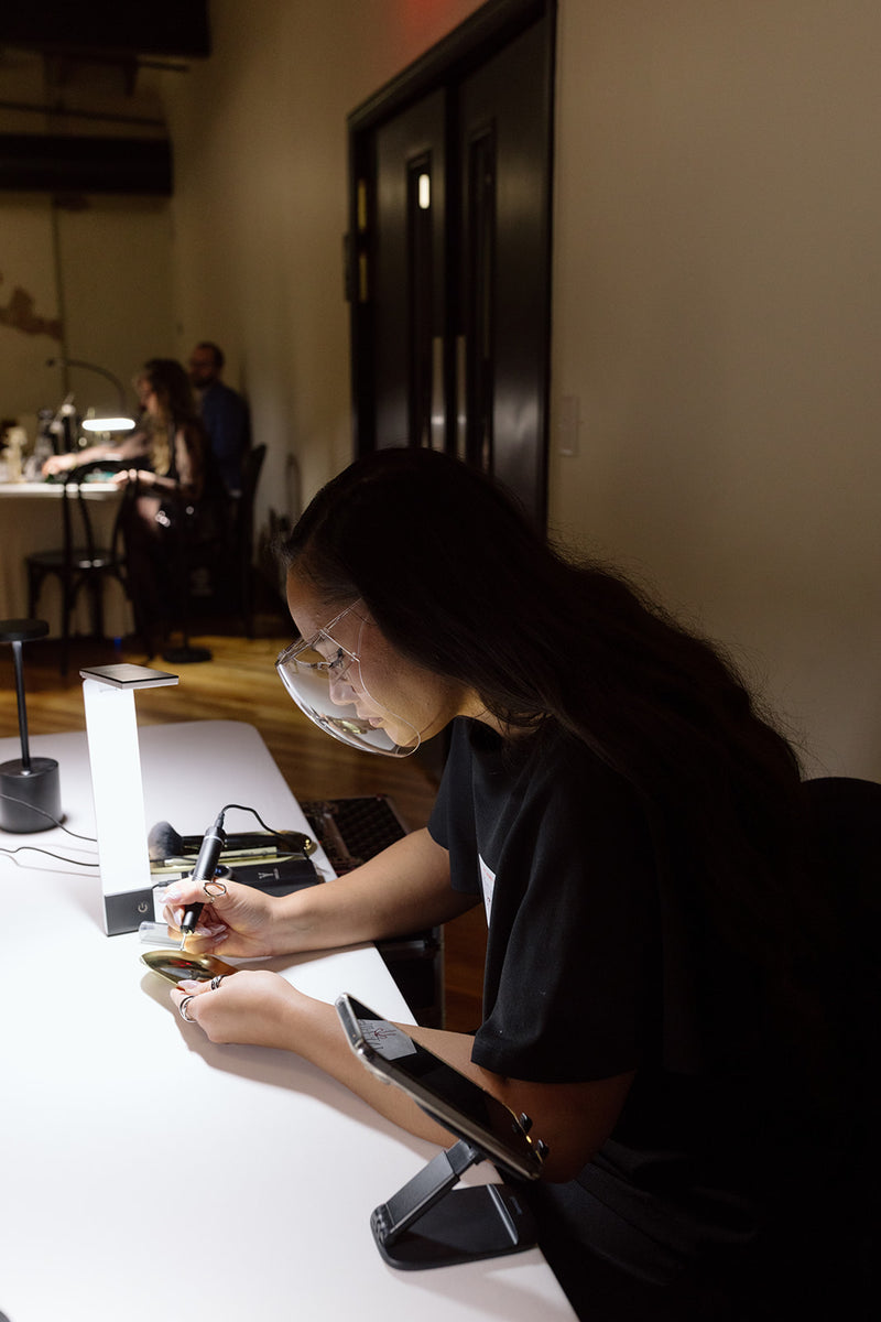 Luxury live engraving of gold jewelry trays by Tiffany at the Faire Sol women empowered event in Lancaster, Pennsylvania.